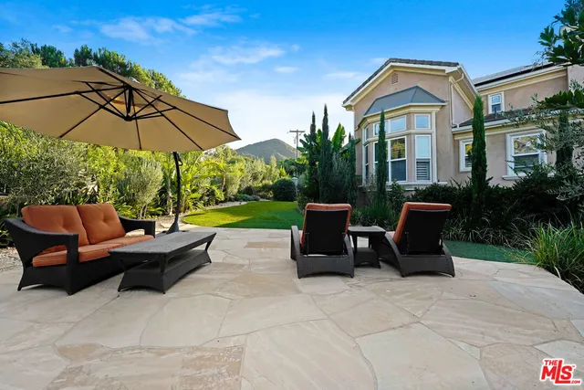 a view of a staircase with a table and chairs