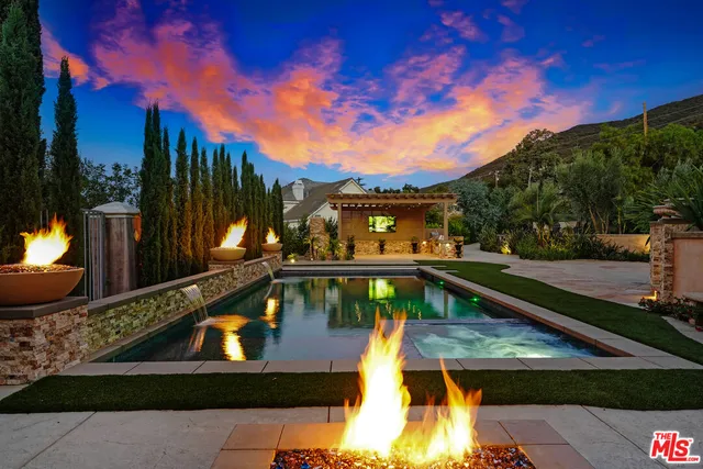 a view of a swimming pool with a patio