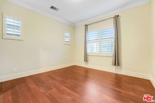 a kitchen with granite countertop a refrigerator a stove a sink dishwasher and a microwave