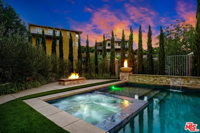 a view of a backyard with sitting area