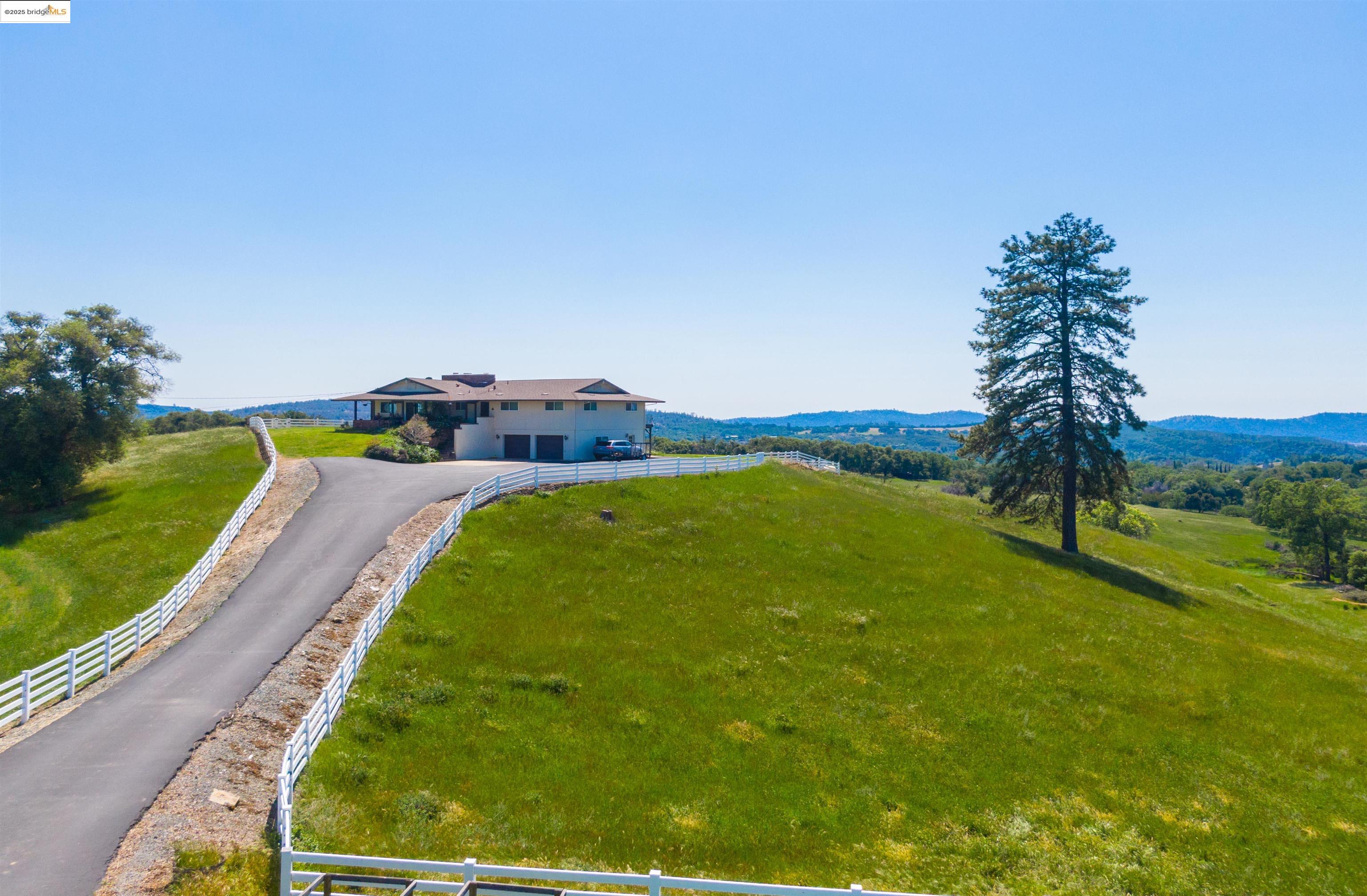 9325 Fraguero Road Sonora, CA 95370 - Photo 1 of 19 a view of back yard of the house