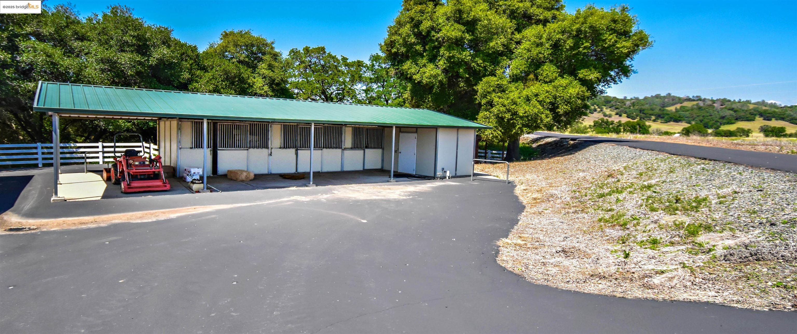 9325 Fraguero Road Sonora, CA 95370 - Photo 9 of 19 a view of a chair and table in the back yard of the house