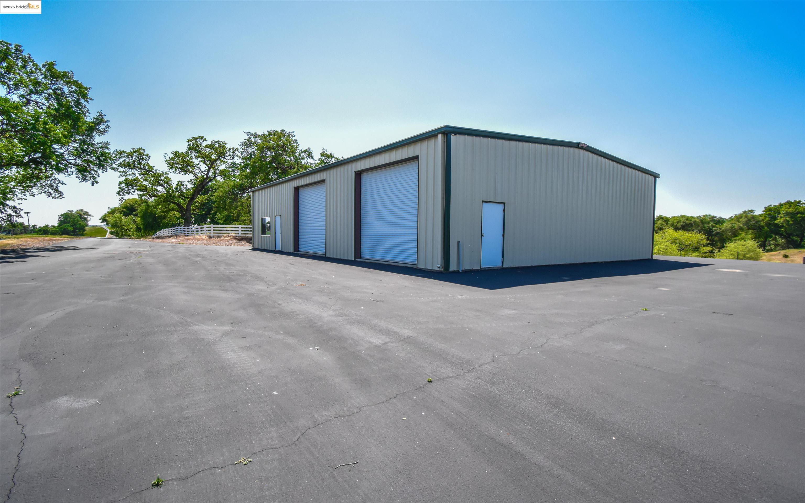 9325 Fraguero Road Sonora, CA 95370 - Photo 10 of 19 a big house with a big yard and large trees