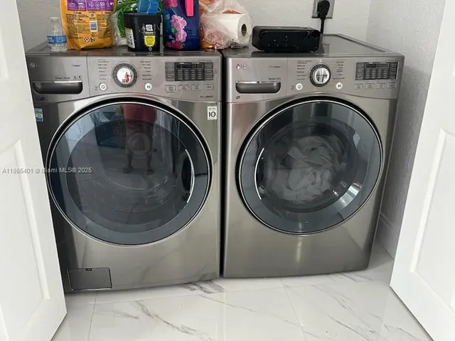 a utility room with dryer and washer