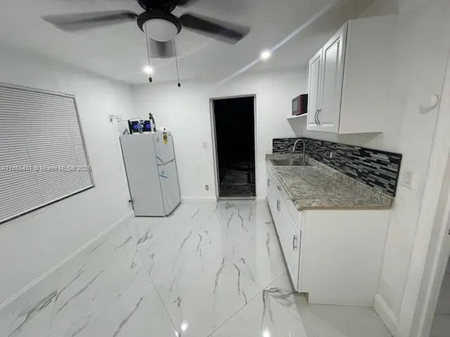 a view of a storage & utility room in a kitchen