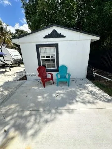 a front view of a house with parking area