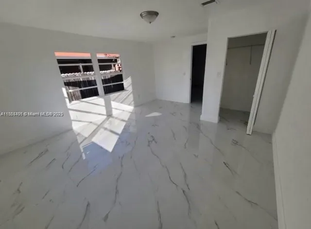 an empty room with empty shelves