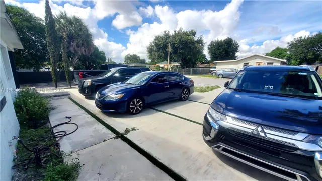 a view of a backyard with sitting area