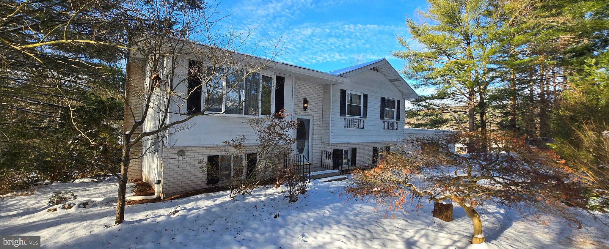 37 White Birch Road Orwigsburg, PA 17961 - Photo 2 of 26 a front view of a house with a yard and garage