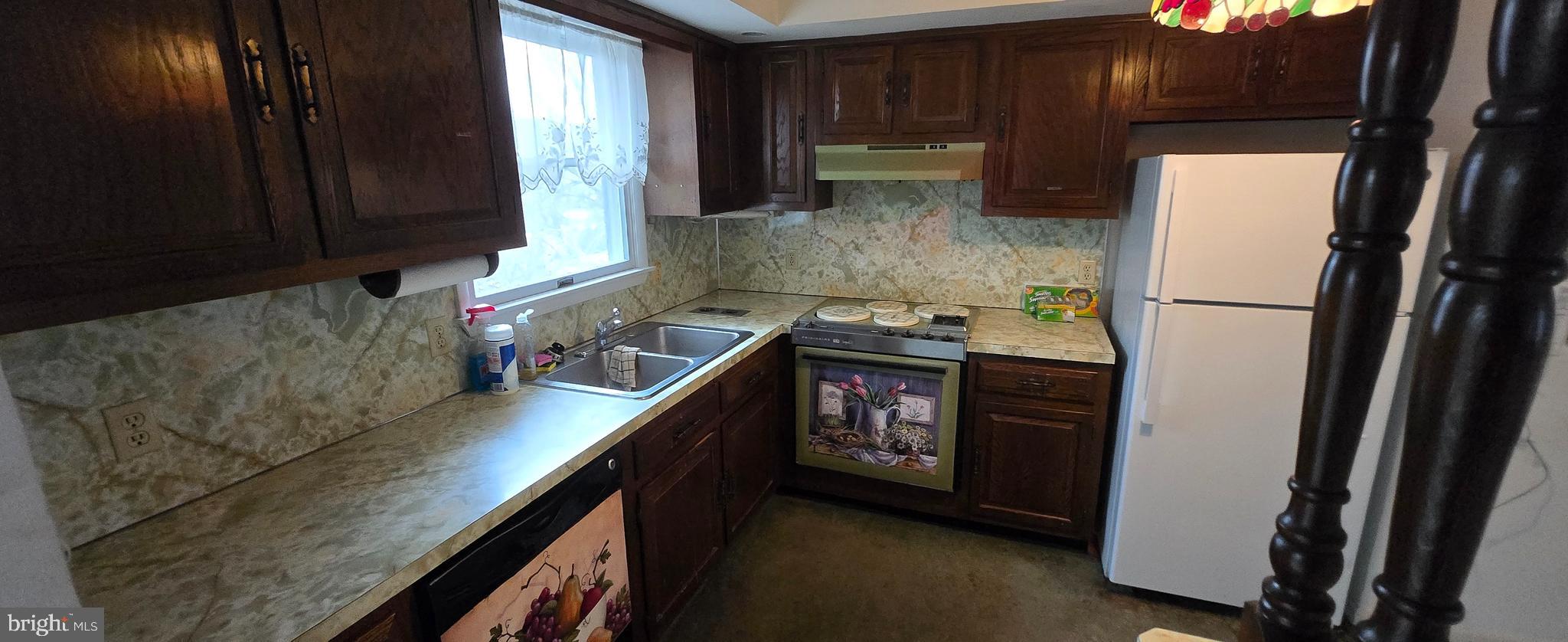 37 White Birch Road Orwigsburg, PA 17961 - Photo 6 of 26 a kitchen with a refrigerator and a stove