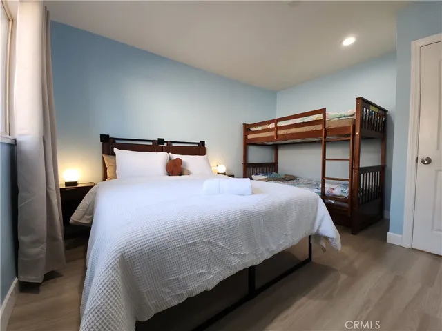 a bedroom with a bed and a closet