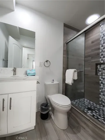 a bathroom with a sink toilet and shower