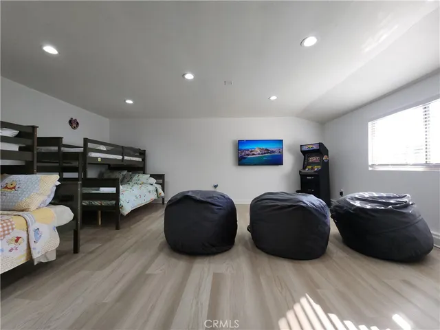 a bathroom with a sink toilet a mirror and shower