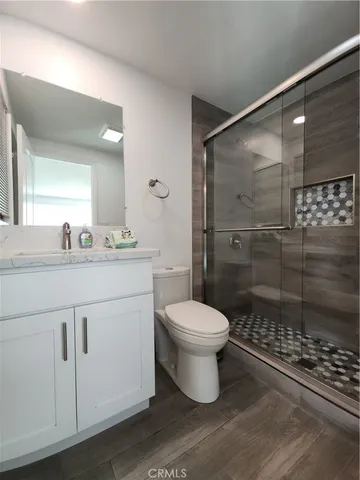 a room with furniture pool table and windows