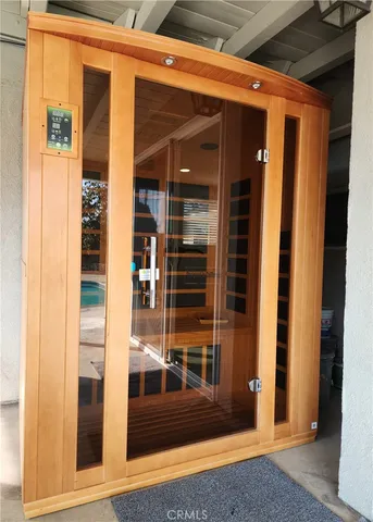 a kitchen with stainless steel appliances kitchen island granite countertop a stove a sink and a refrigerator