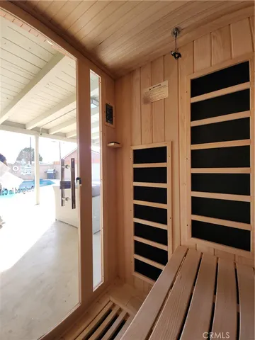 a view of closet with wooden floor