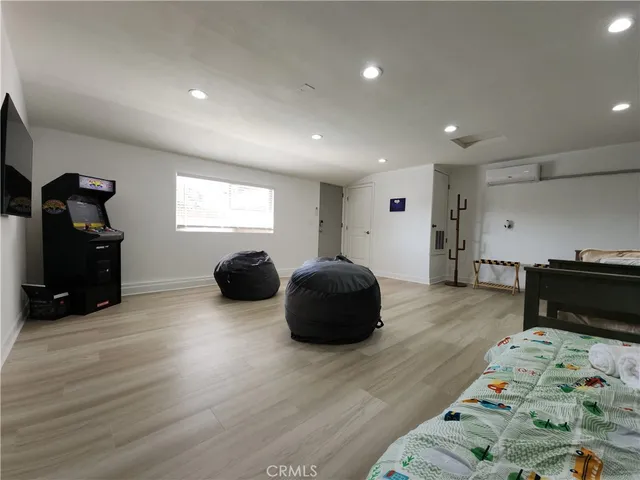 a bedroom with furniture and a window