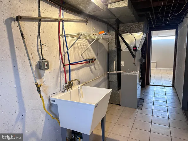 a dining room with furniture and a window