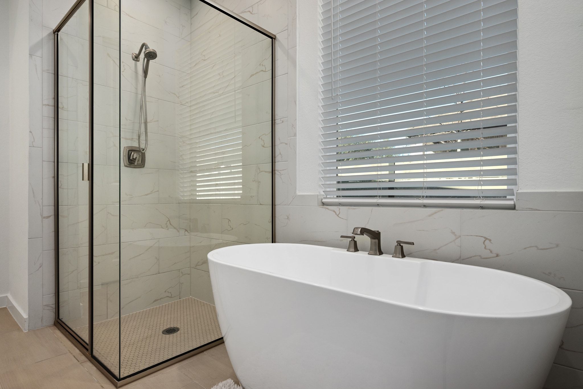 1201 Highcrest Georgetown, TX 78628 - Photo 25 of 40 The ensuite features a free-standing soaking tub and a separate walk-in shower with upgraded tile flooring.
