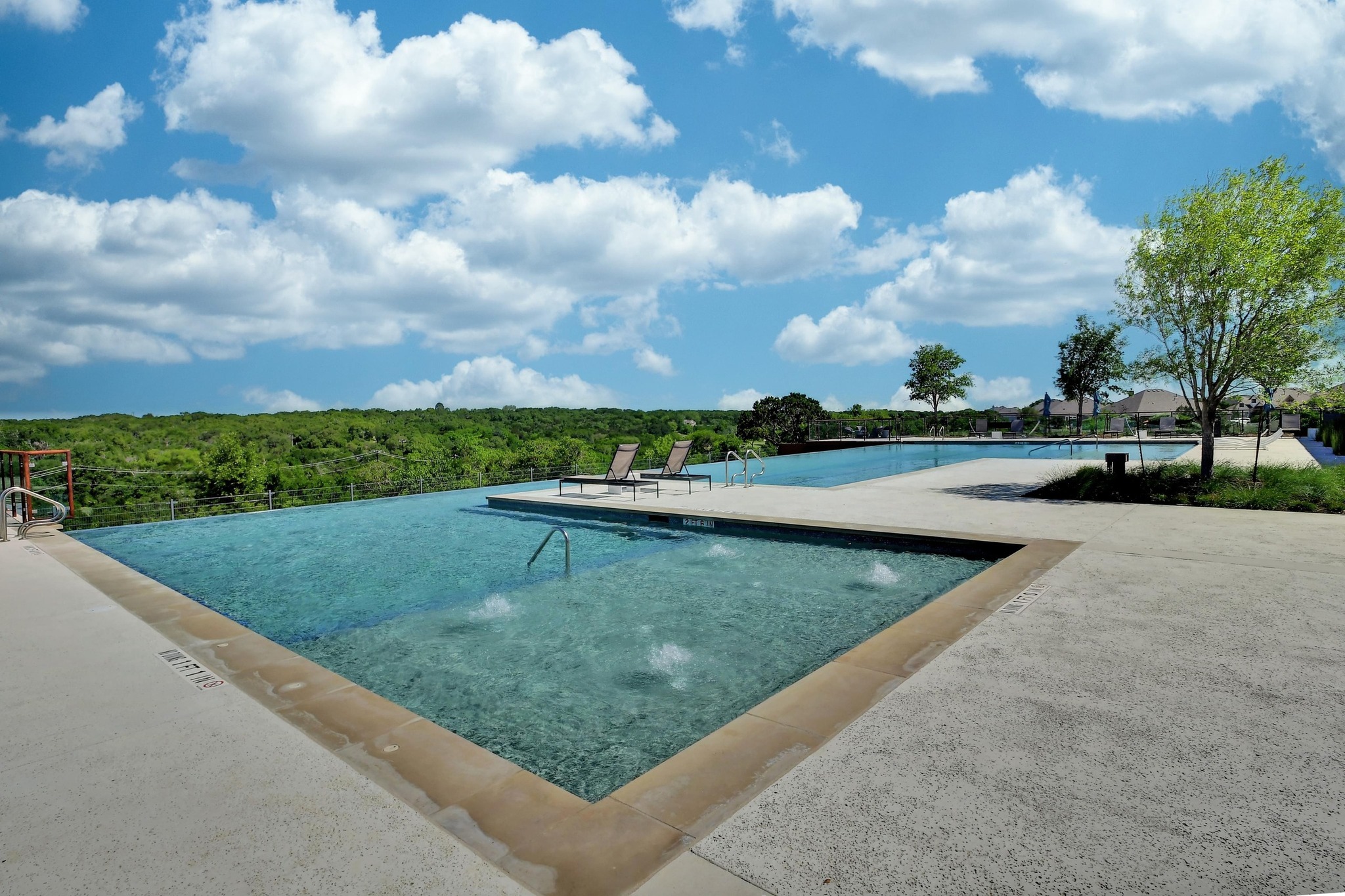 1201 Highcrest Georgetown, TX 78628 - Photo 37 of 40 The sparkling pools are no exception to the captivating views this community offers.