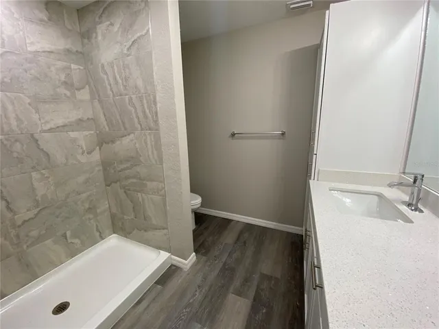 a bathroom with a tub and sink