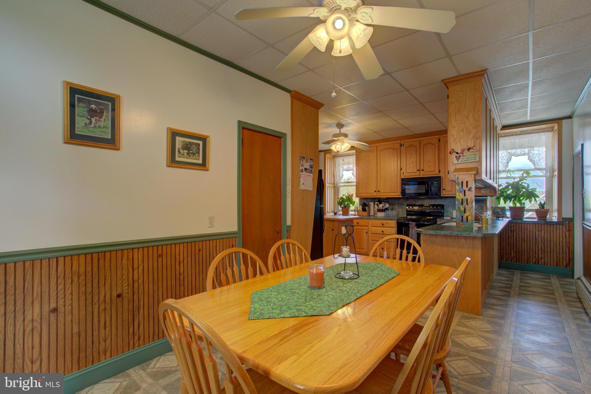 230 School Road Bethel, PA 19507 - Photo 11 of 12 a dining room with furniture and wooden floor