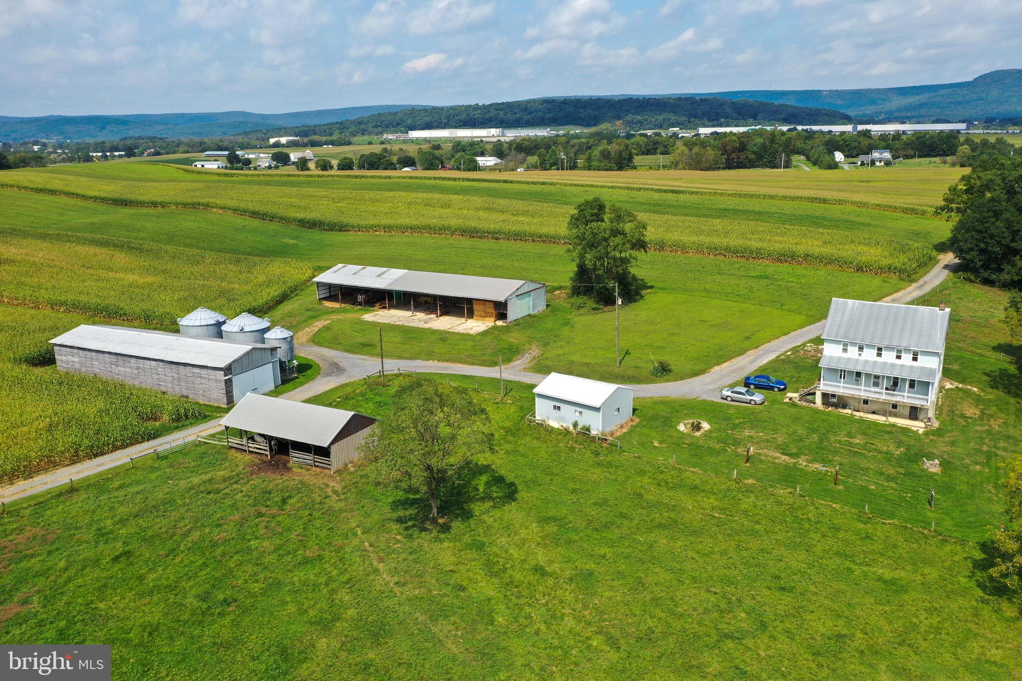 230 School Road Bethel, PA 19507 - Photo 7 of 12 an aerial view of a house with a garden and lake view