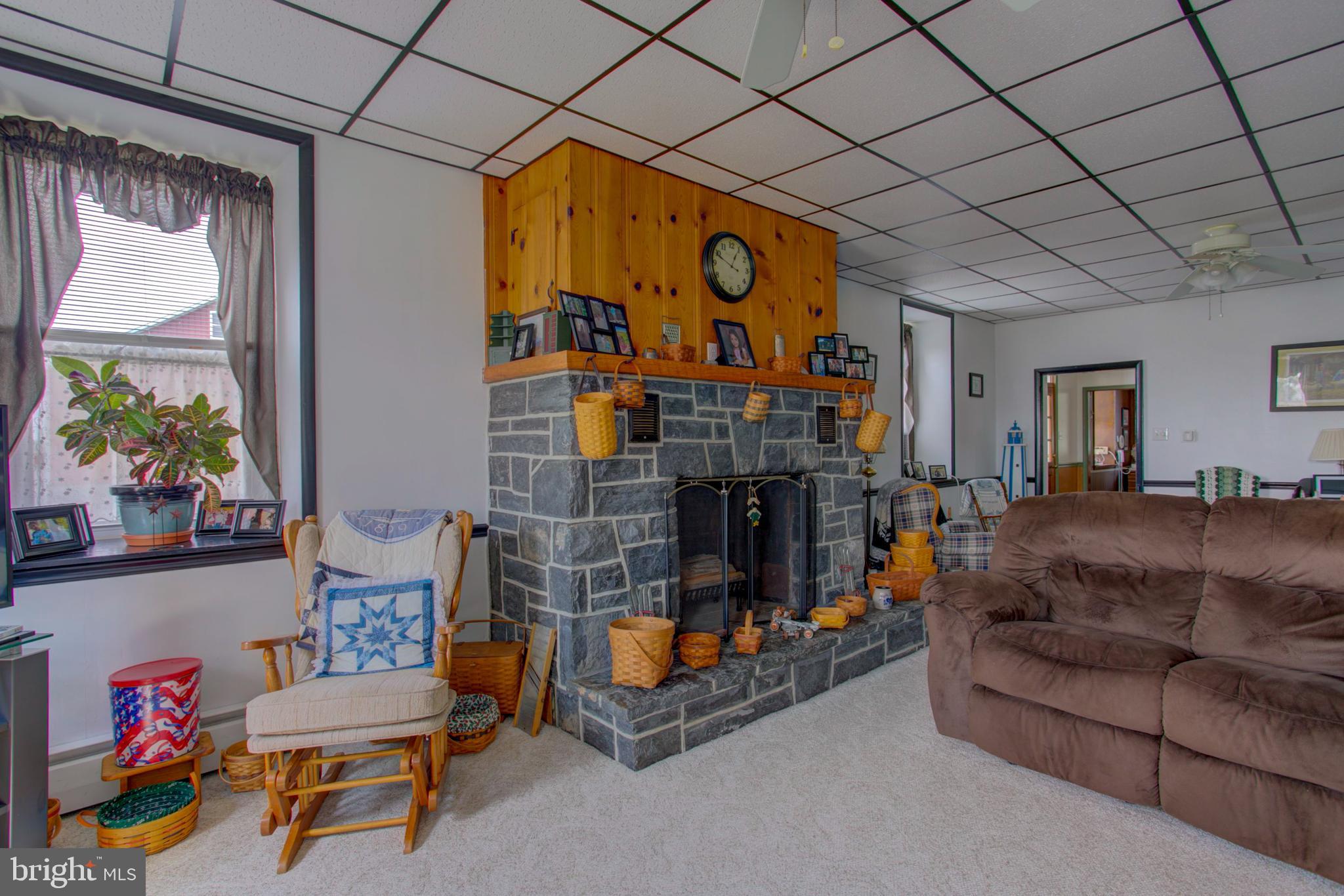 230 School Road Bethel, PA 19507 - Photo 10 of 12 a living room with furniture a couch and a table