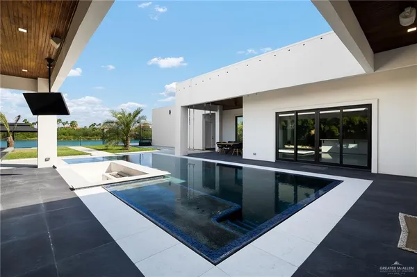a view of swimming pool with seating area