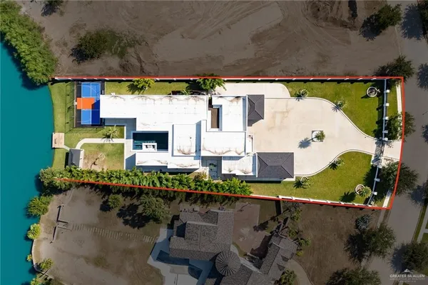 an aerial view of a house with a swimming pool