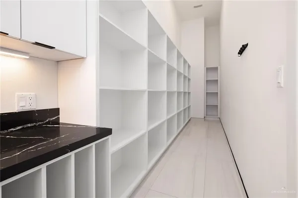 a view of a living room and floor to ceiling window