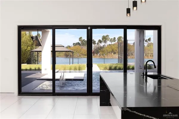 a room with gym equipment and view of living room