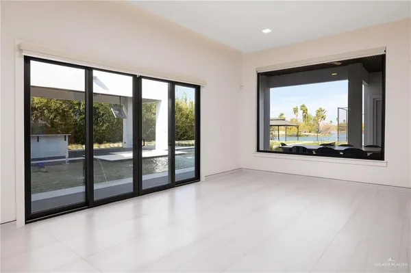 a living room with a couch and a dresser next to a window