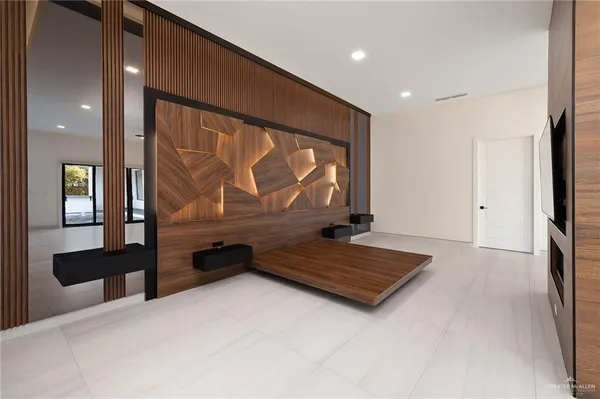 a living room with stainless steel appliances kitchen island granite countertop a stove and a sink