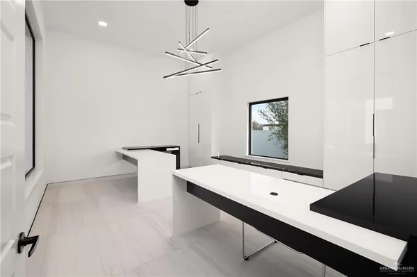 an empty room with a empty space and windows