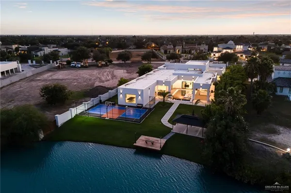 an aerial view of a house with a yard
