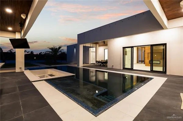 a view of swimming pool with seating area