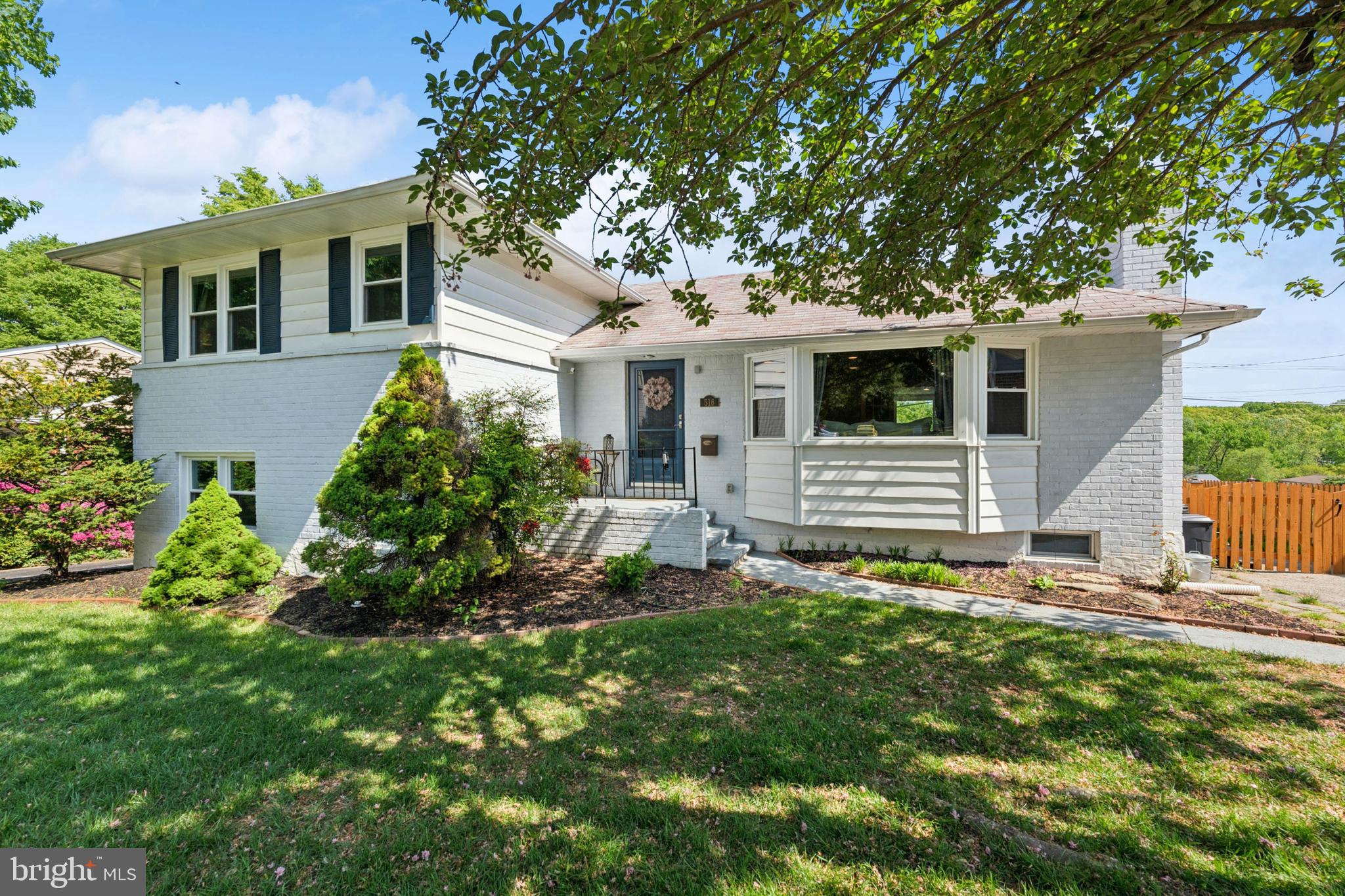 516 Epsom Road Towson, MD 21286 - Photo 1 of 11 a front view of a house with a garden