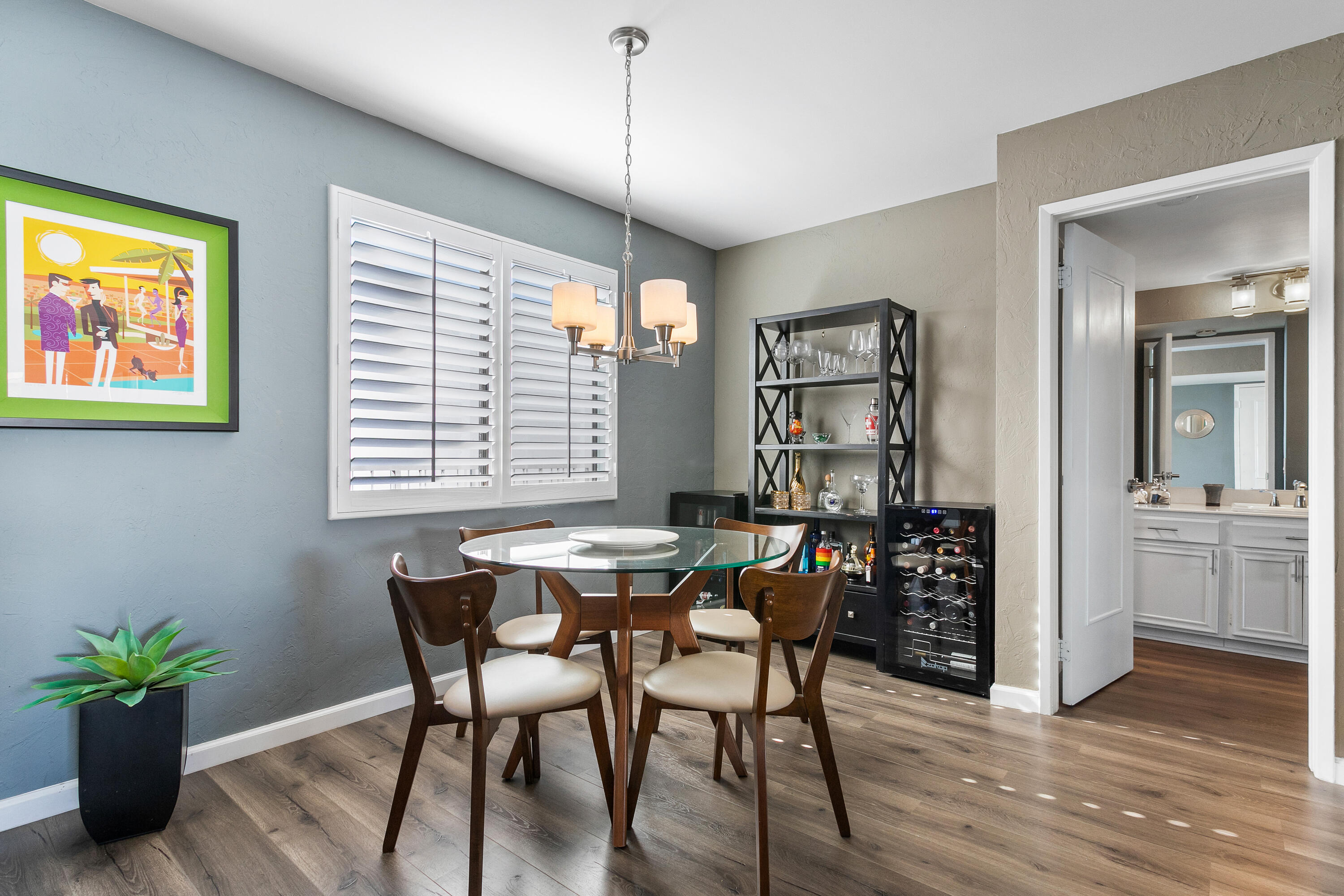 1050 Ramon Road, Unit 128 Palm Springs, CA 92264 - Photo 8 of 35 a view of a dining room with furniture window and wooden floor