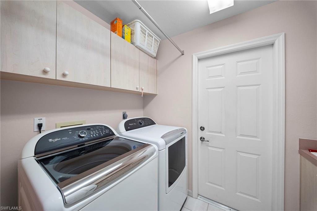 3971 Spring Garden Lane Estero, FL 33928 - Photo 27 of 31 a utility room with dryer and washer