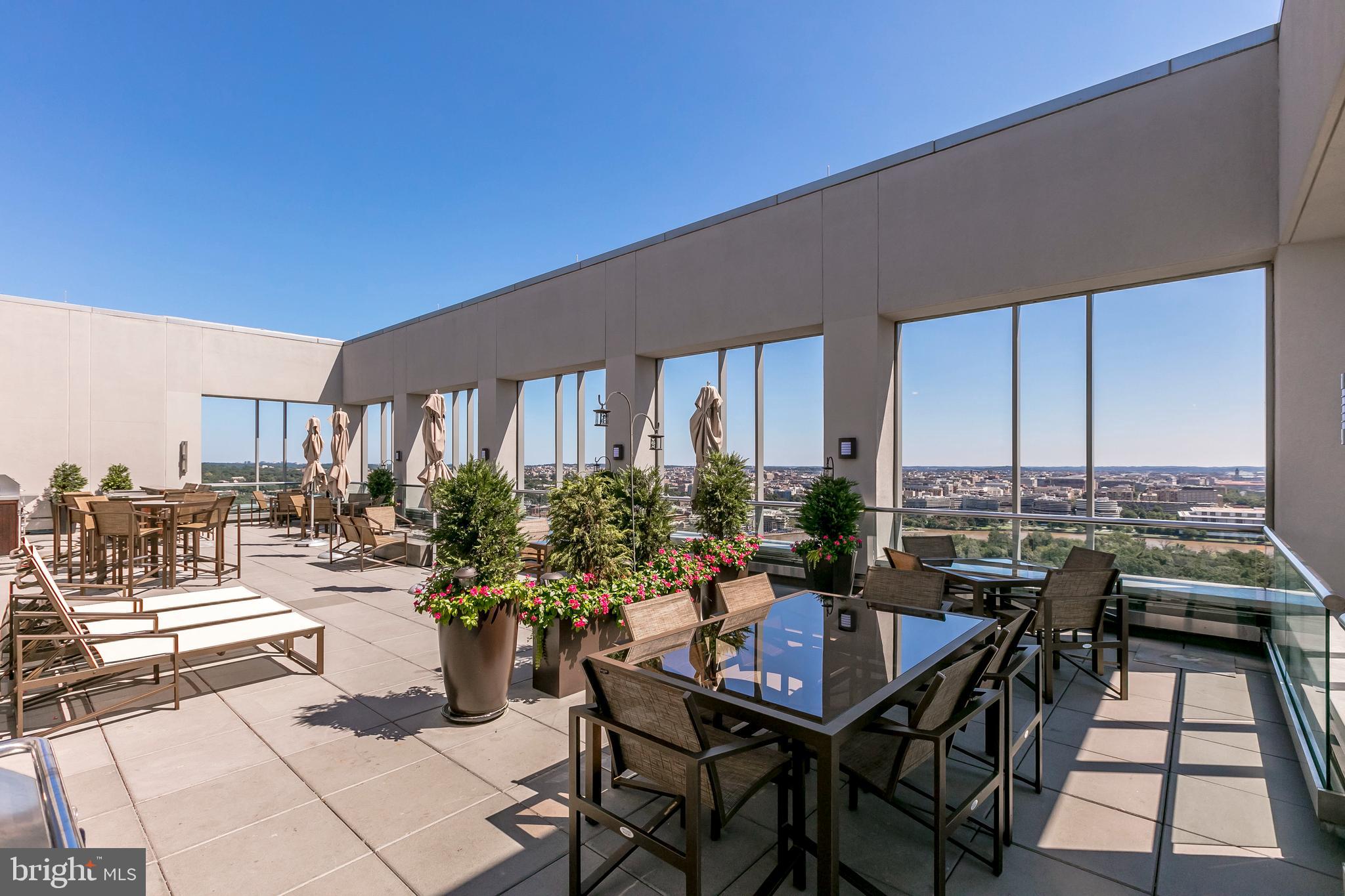 1111 19th Street North, Unit 1706 Arlington, VA 22209 - Photo 13 of 15 a view of a terrace with seating area and city view