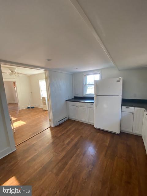 23484 Deal Island Road Deal Island, MD 21821 - Photo 4 of 25 a view of a kitchen with wooden floor and electronic appliances