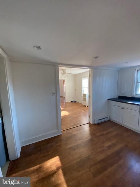 23484 Deal Island Road Deal Island, MD 21821 - Photo 5 of 25 a view of empty room with wooden floor