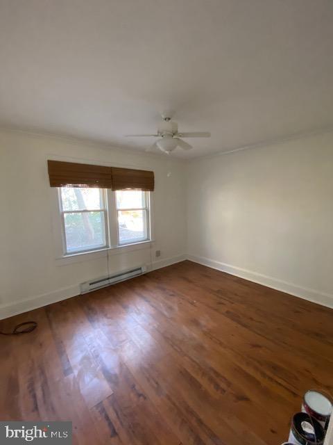 23484 Deal Island Road Deal Island, MD 21821 - Photo 6 of 25 an empty room with wooden floor and windows