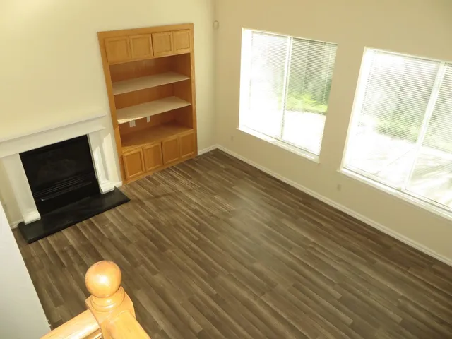 a view of a livingroom with wooden floor