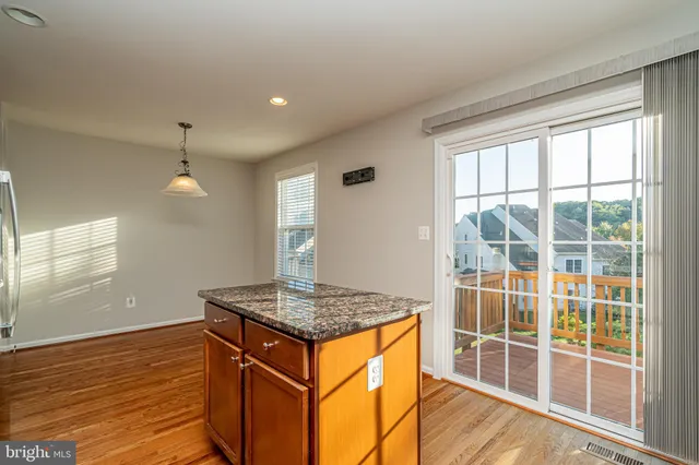 a room with wooden floor and window