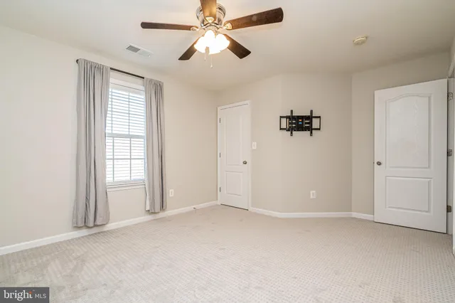 a bathroom with a double vanity sink mirror and shower