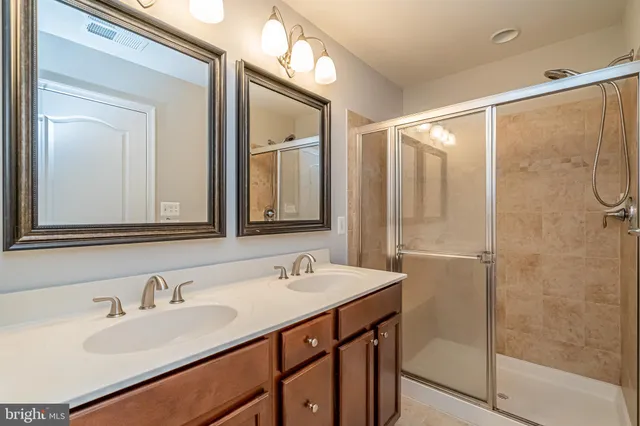 a bathroom with a glass shower door