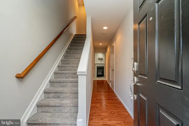 a view of a hallway with stairs