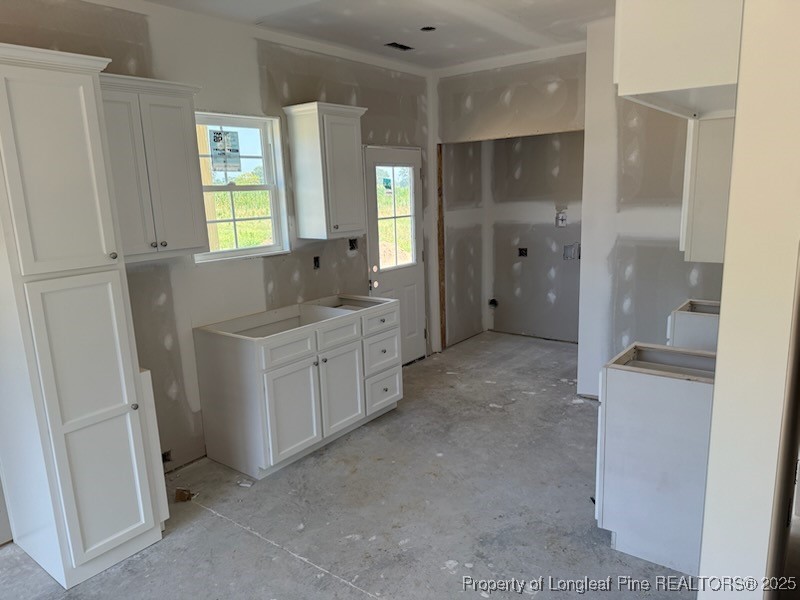3939 Godwin Lake Road Benson, NC 27504 - Photo 5 of 5 a bathroom with a double vanity sink a toilet and a shower
